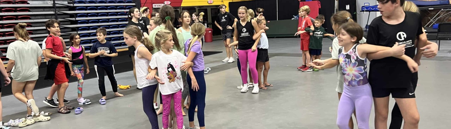 IMG_9397 Kids gymnastics and circus arts training at indoor circus staging area.