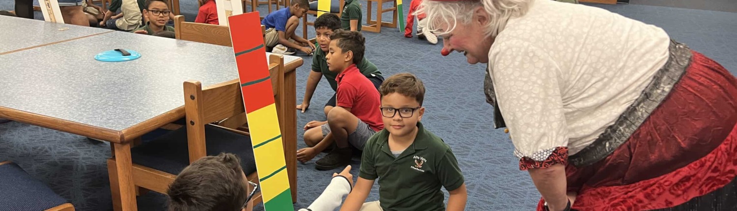 Colorful circus-themed stage setup with children participating in engaging activities.