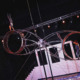Aerial performance on circus staging with acrobats and metabolic rings, illuminated stage with lighting effects.