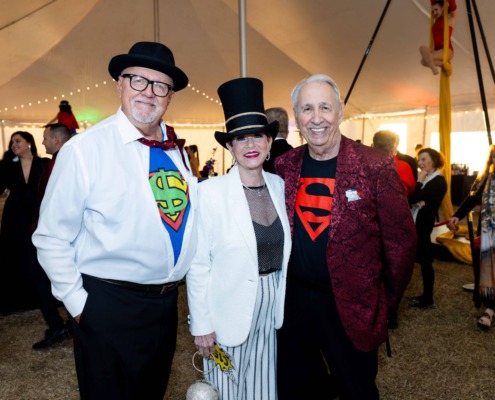DC4A98-Circus-staging-event-organzied-for-children-and-families-in-an-enclosed-tent-with-performers-and-organizers-wearing-superman-theme-costumes.