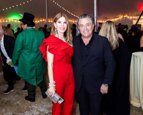 Circus staging performance at a festive event with people enjoying the outdoor carnival atmosphere.